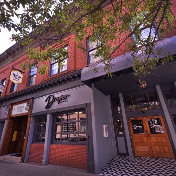 P&C_Draper Purveying Company_1 Draper Purveying Company is a new restaurant opening in the former Barley’s space on W. Washington Street in downtown Greenville.
The downstairs will be a full-service restaurant serving lunch, dinner, and weekend brunch. Upstairs will feature a supper club with live music, small bites and crafted cocktails.